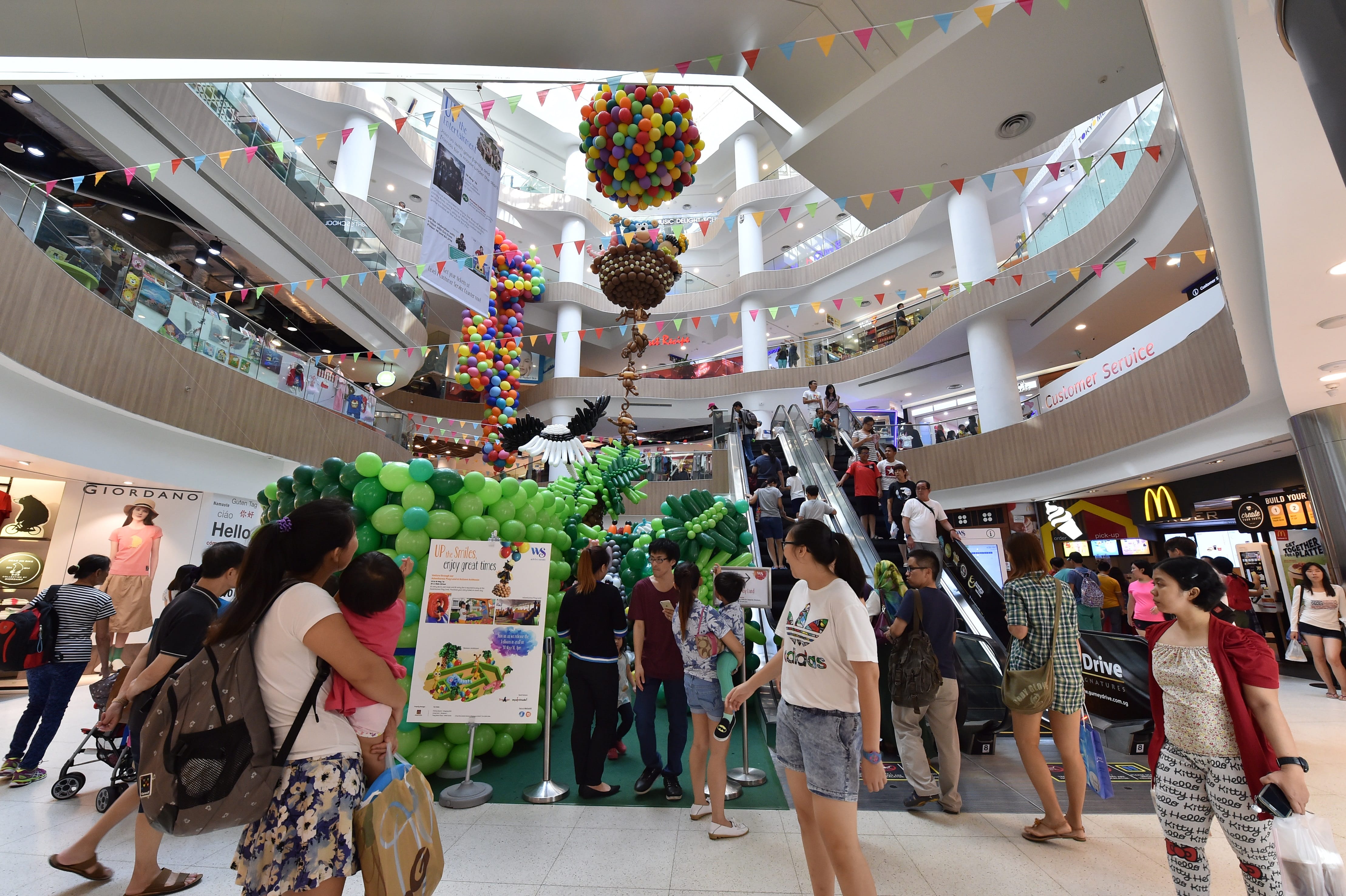 Interior of White Sands atrium filled with activities and people
