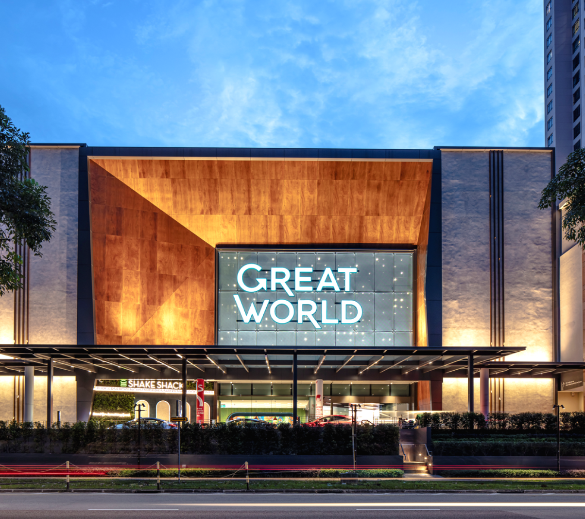 Lit up facade of Great World Mall in the evening