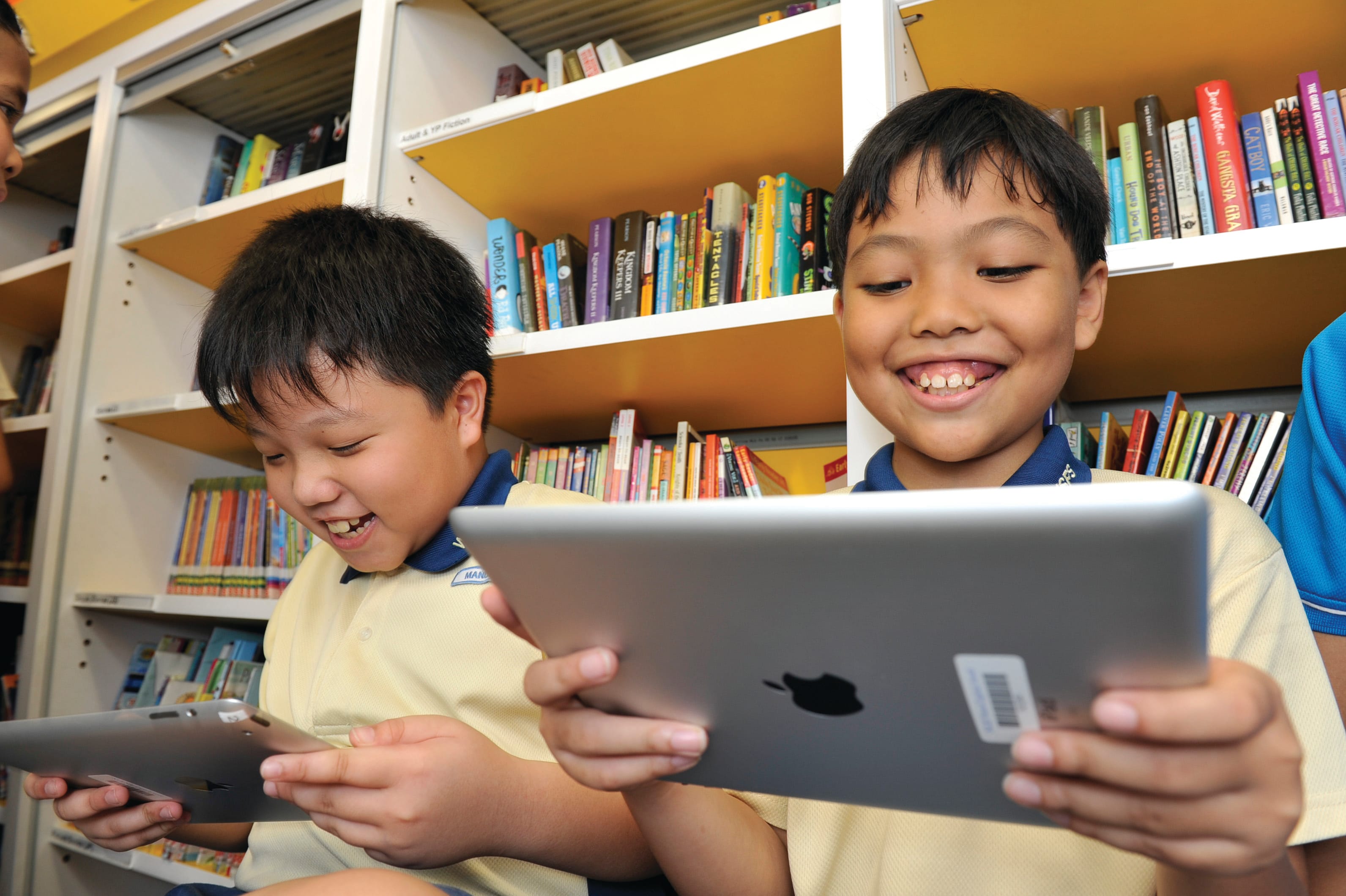 Children using iPads available aboard Molly.