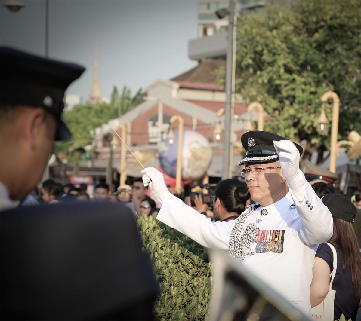 Amri Amin conducting the Singapore Police Force Band during the street parade performance of the 23rd World Police Band Concert held in Bangkok, Thailand, 2018. Courtesy of the Singapore Police Force Band.