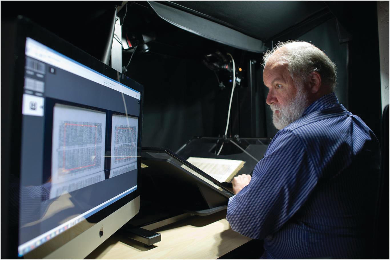 A University of British Columbia library staff digitising a book. Image by Don Erhardt.