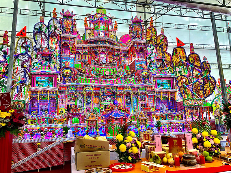 During the ceremony inviting Huang Guniang to Wat Ananda Metyarama, a paper mansion was also burnt for her, 2022. Courtesy of Raymond Goh.