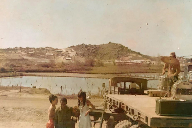 Setting up the stage at the back of an army truck, 1969. Courtesy of Veronica Young.