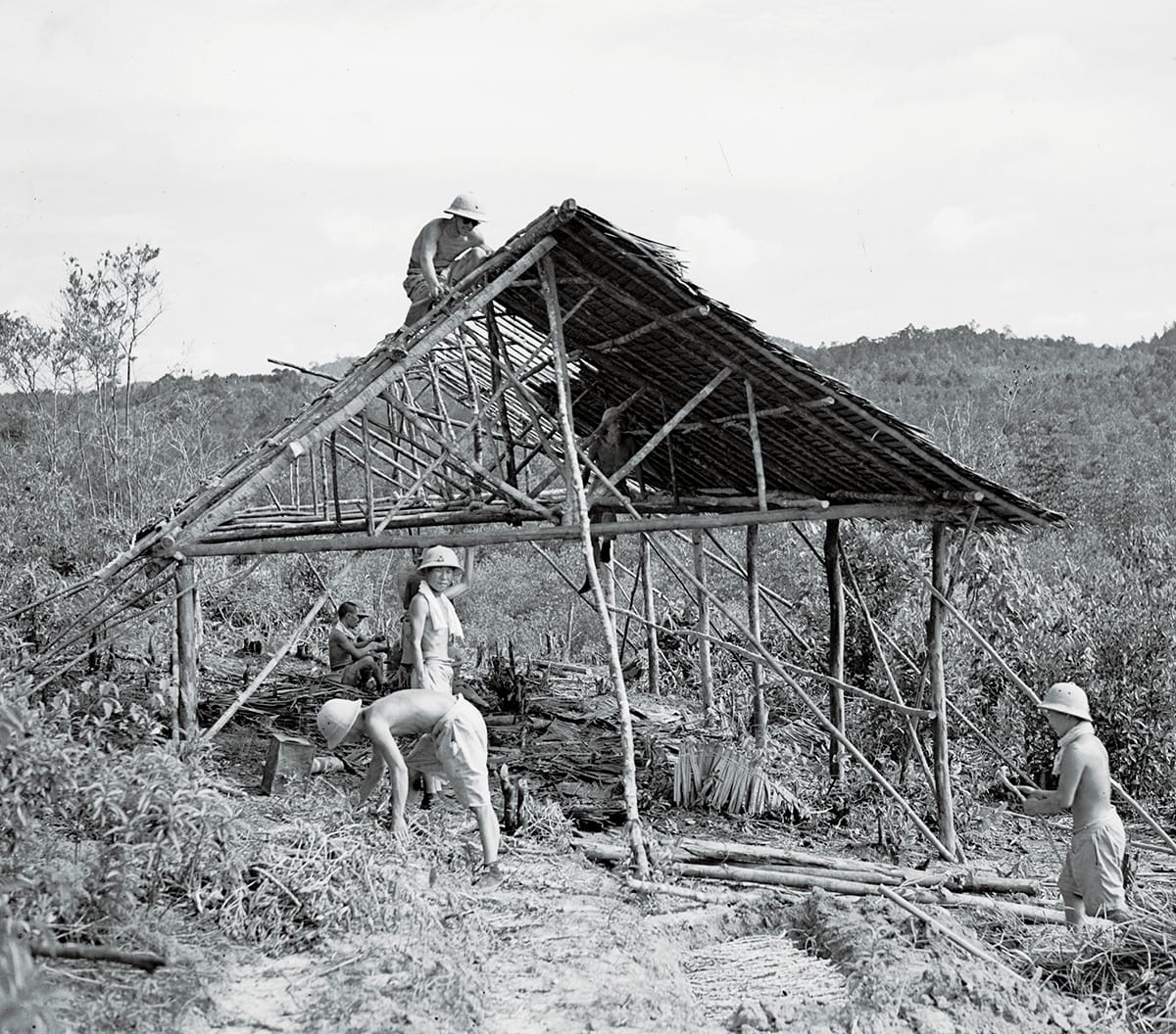 Japanese soldiers building a thatched hut, 1945. Imperial War Museums (A 30956).