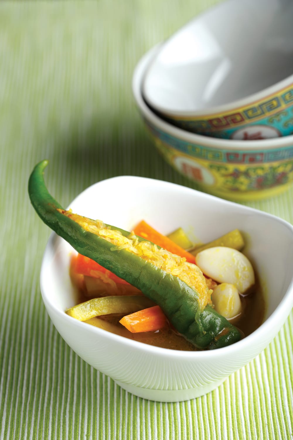 The piquant Peranakan cucumber and stuffed chilli pickle cannot be bought off the shelf, and is only occasionally made in home kitchens by energetic aficionados of the cuisine. All rights reserved, Tan, S. (2011). Modern Nonya. Singapore: Marshall Cavendish Cuisine.