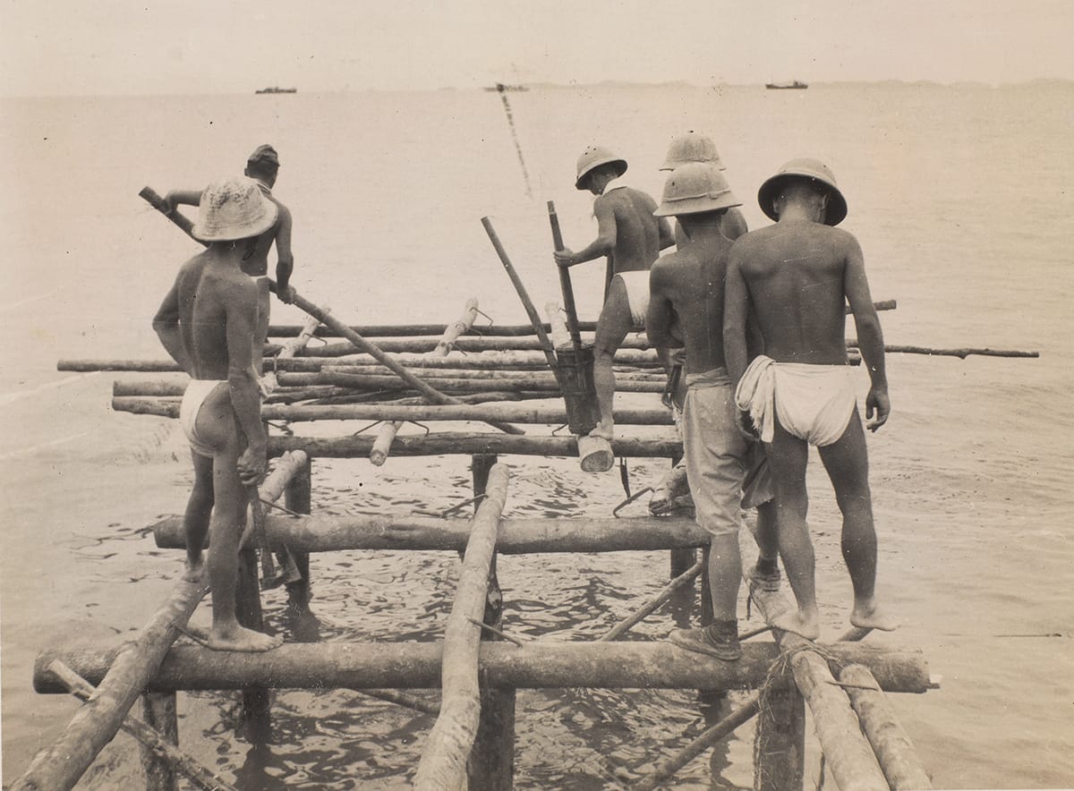 Japanese soldiers building the jetty on Rempang, 1945. Image courtesy of the National Army Museum, London (NAM. 2009-11-4-7).