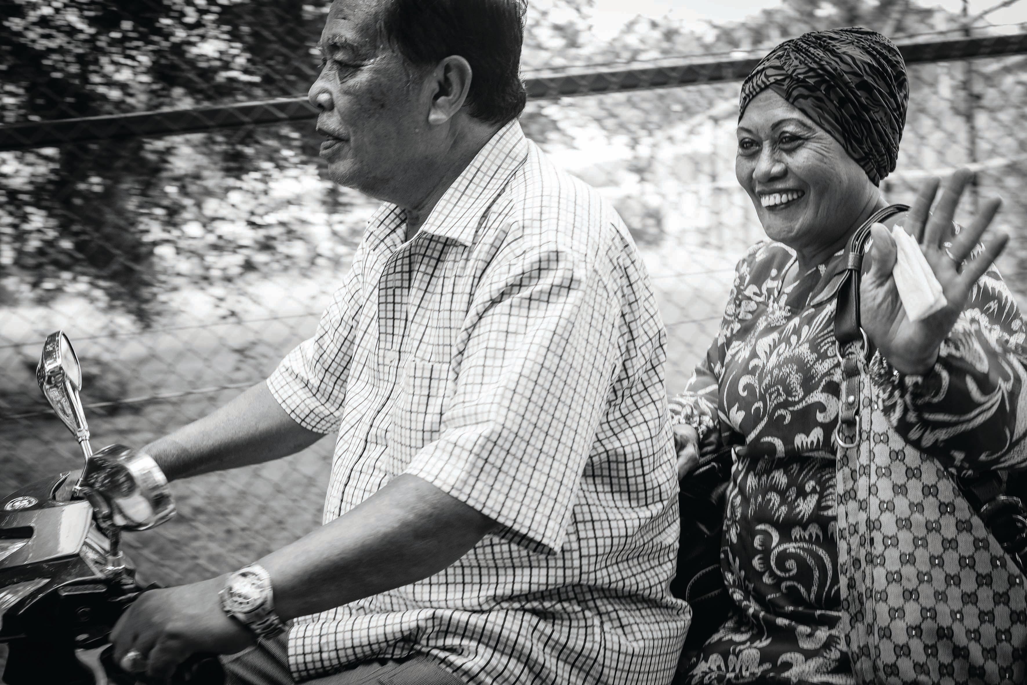 Mohamed Sulih Bin Supian uses an electric bike to get around the island. Here he and his wife make their way to the St John's Island jetty to visit their children in time for Hari Raya Aidilfitri celebrations. Photo by Edwin Koo.