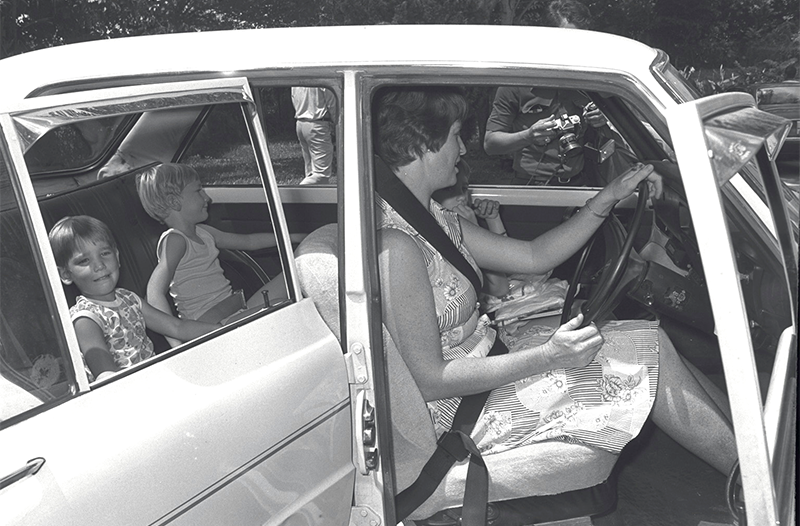 One of 30 drivers stopped by the National Safety First Council for a spot check in conjunction with the National Seat Belt Campaign, 1977. Seat belts had been fitted to the front and back of her car, and her children were safely strapped in their seats. Source: The Straits Times © SPH Media Limited. Permission required for reproduction.
