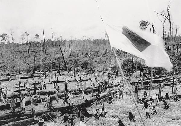 The first settlers to Bahau – mainly young, single men – had to clear the land, build a rudimentary road from the train station to the camp and set up basic infrastructure before the families started to arrive (Japanese propaganda photo). Courtesy of Father René Nicolas.