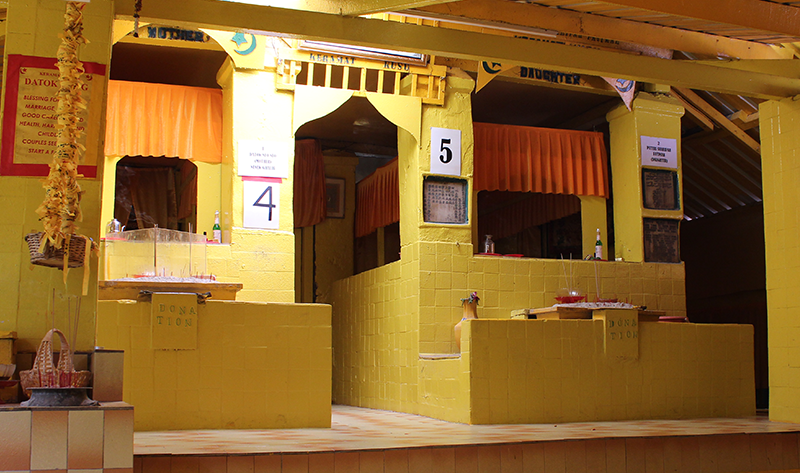 The two female shrines as seen from Dato Abdul Rahman’s shrine (stations 4 and 5 in the order of offerings) before the fire, 2022. The plaques from 1917 and 1921 could be seen embedded in the columns; the 1921 plaque was beneath the number 5. Courtesy of William L. Gibson.