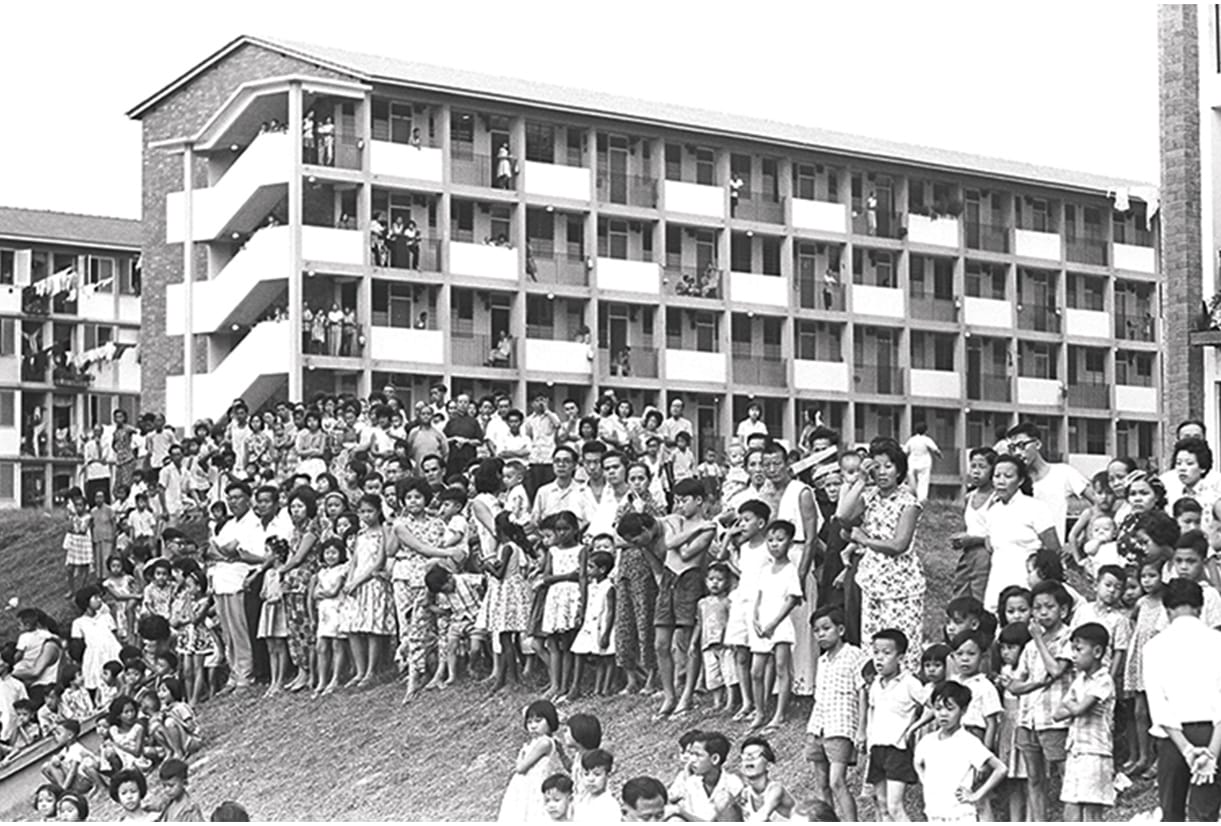 Flat dwellers waiting for then Prime Minster Lee Kuan Yew during his tour of Tiong Bahru, Delta and Havelock housing estates in 1963. Ministry of Information and the Arts Collection, courtesy of National Archives of Singapore.