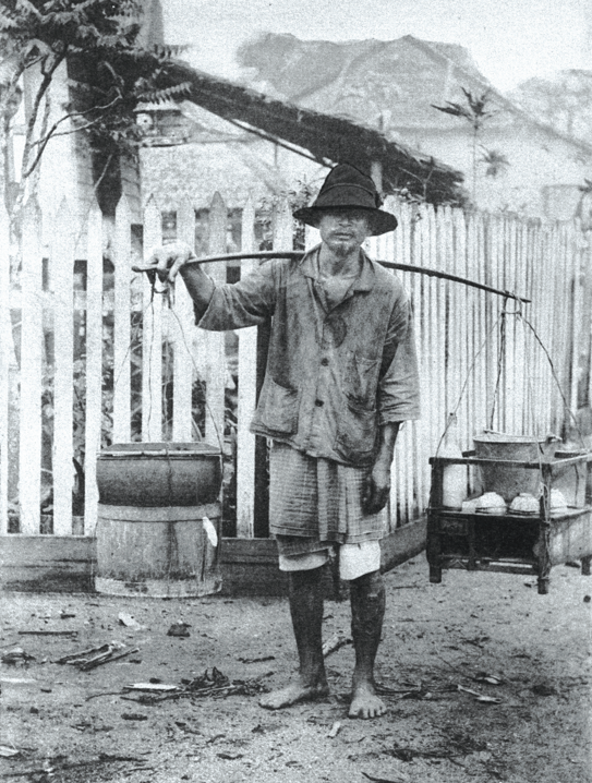 A Malay hawker with his portable satay stall in 1907. Courtesy of National Archives of Singapore.