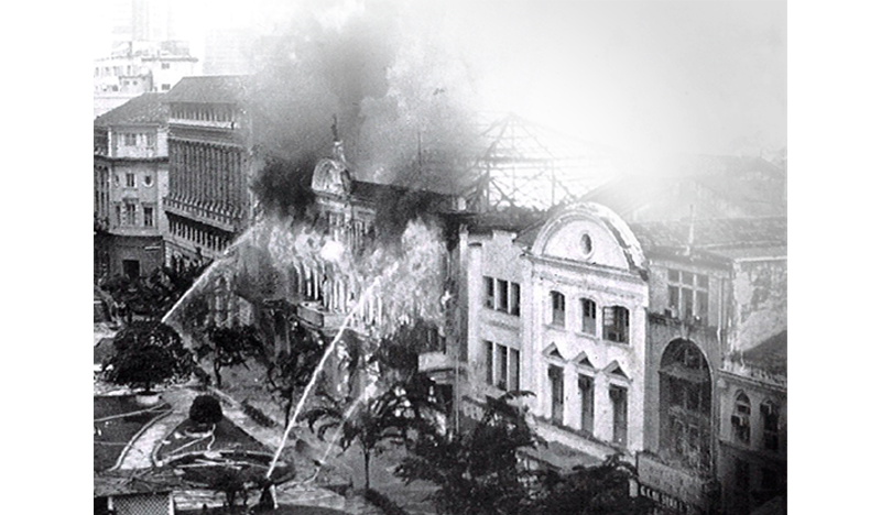 The Robinsons store in Raffles Place engulfed in flames. The fire on 21 November 1972 completely gutted the building and destroyed millions of dollars worth of goods. Nine people died in the fire. Image reproduced from Robinsons and Company (Singapore). (2002, December). Family News: The Staff Newsletter of the Robinsons Group (p. 11). Singapore: The Robinsons Group. (Call no.: RSING 338.47658871 FN).