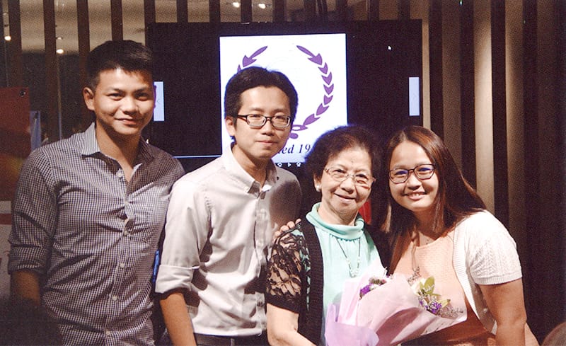 Cai Mingying (holding bouquet) with staff of Union Book at the at bookstore’s 65th anniversary dinner in 2017. Courtesy of Union Book.