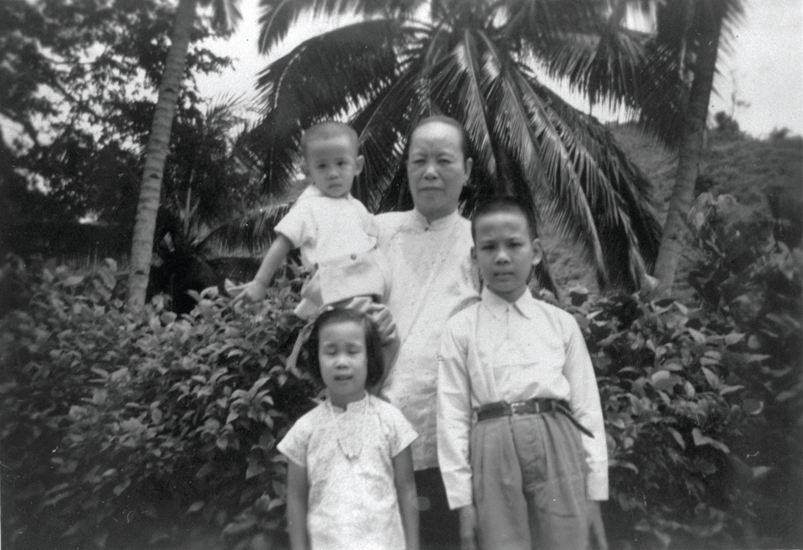 An amah with her employer’s children, 1942. Courtesy of National Archives of Singapore.