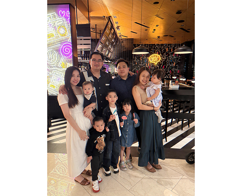 Photograph taken after a family dinner with my brother (right) and our families in Singapore, 2025. Our children represent the fourth generation of the Zhuang family in Singapore. Courtesy of Chung Kwang Tong.