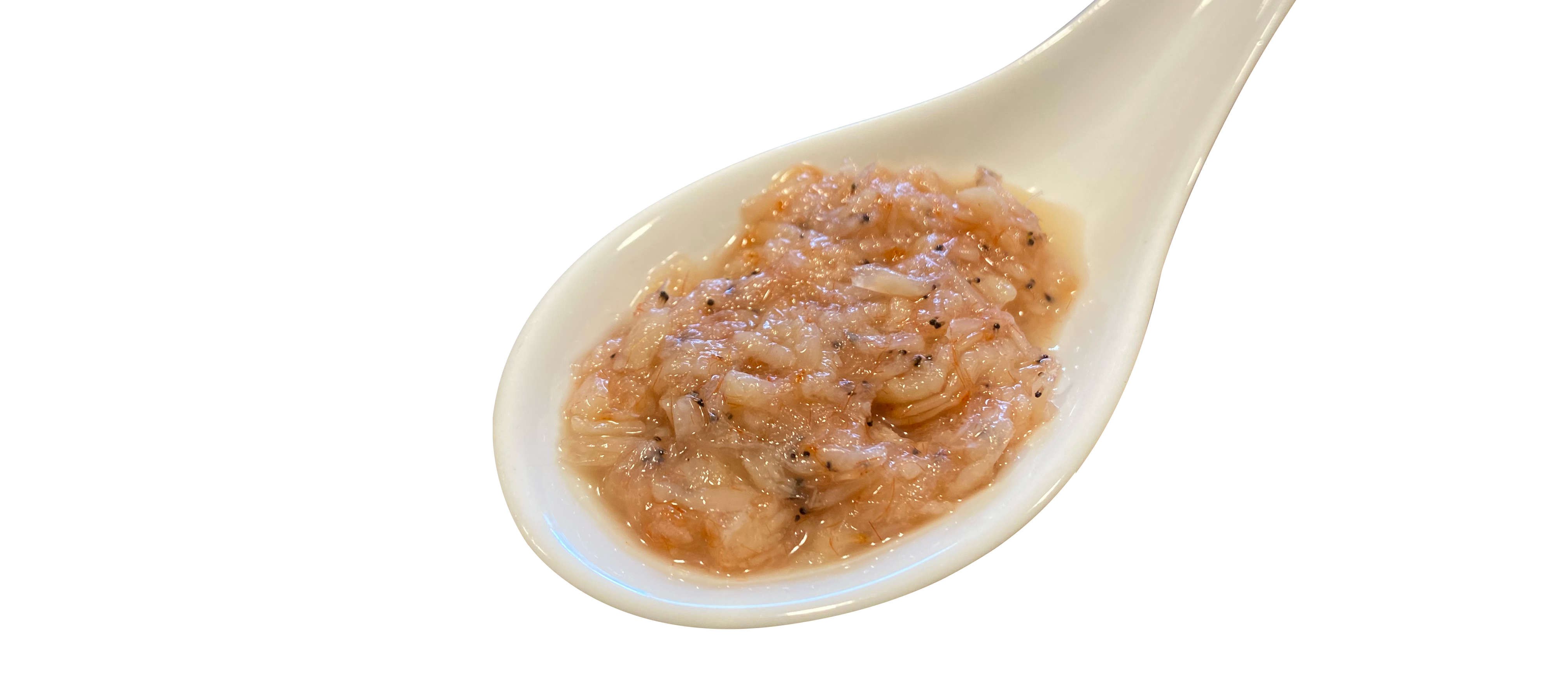Cincalok in a Chinese soup spoon. Cincalok is a fermented shrimp product made from the same tiny shrimp (Acetes spp.) used in belacan. Photo by Jimmy Yap.