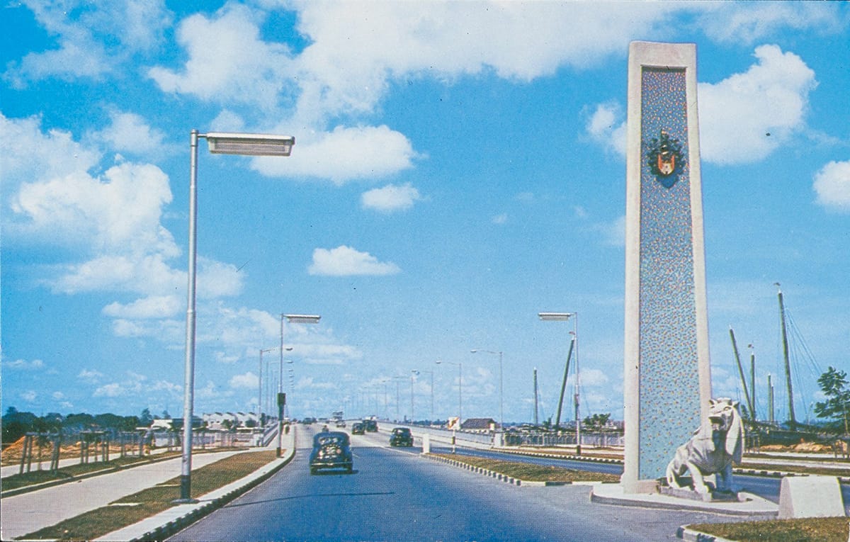 One of the stone lions and its accompanying 9-metre-tall mosaic pylon at one end of Merdeka Bridge, 1960s. Collection of the National Museum of Singapore, courtesy of National Heritage Board.