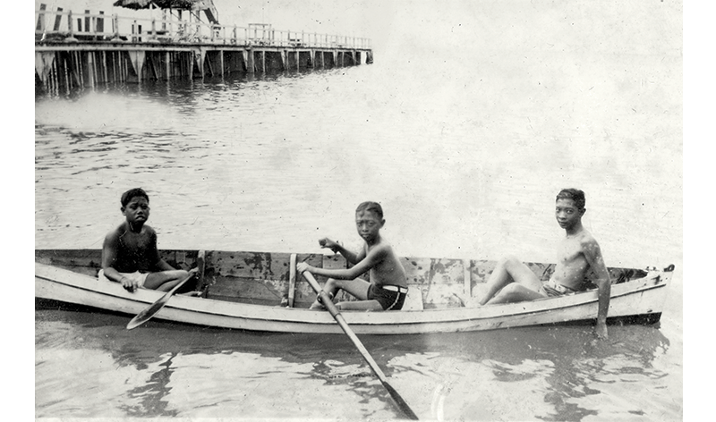 Lee Kip Lin (centre) with his brother Kip Lee (right) and a neighbour on a boat just off their family home in Amber Road, Katong, c. 1935. Courtesy of Mrs Lee Li-ming.
