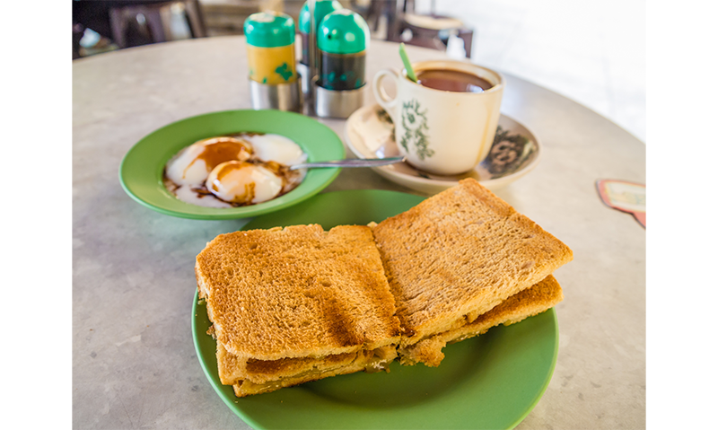 Kaya toast paired with half-boiled eggs is a popular breakfast item in Singapore. From Shutterstock.