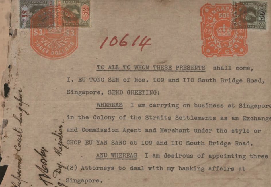 An old document with stamps and typed text about appointing attorneys, signed handwritten notes are visible on the left side.