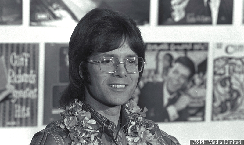 A year after he cancelled his concerts in Singapore, Cliff Richard, still sporting long hair, was allowed into Singapore for a one-night stopover on 13 April 1973. Not here on a summer holiday, he was en route to Australia and New Zealand. Source: The Straits Times © SPH Media Limited. Reprinted with permission.