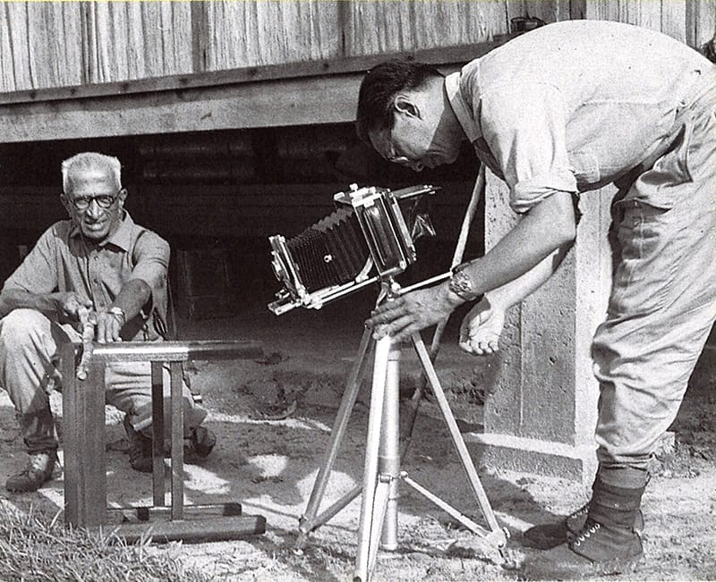 Loke Wan Tho (right) and Indian ornithologist Salim Ali preparing equipment before a field trip. Image reproduced from Lim Kay Tong, Cathay: 55 Years of Cinema (Singapore: Landmark Books, 1991), 11. (From National Library, Singapore, call no. RSING 791.43095957 LIM).