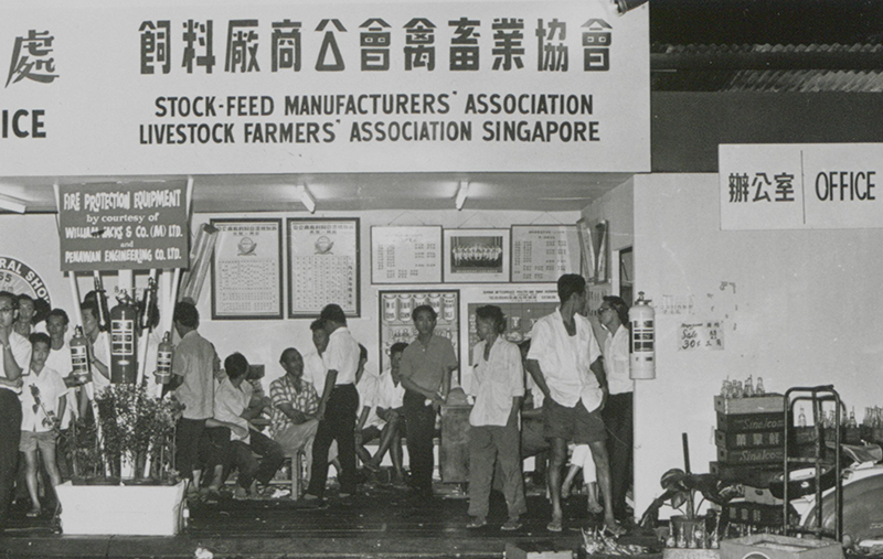 Visitors at the booth of the Stockfeed Manufacturers’ Association and the Livestock Farmers’ Association, 1965. These two associations worked with the Primary Production Department to organise the agricultural show. Primary Production Department Collection, courtesy of National Archives of Singapore (Media - Image no. 20060000820 - 0093).