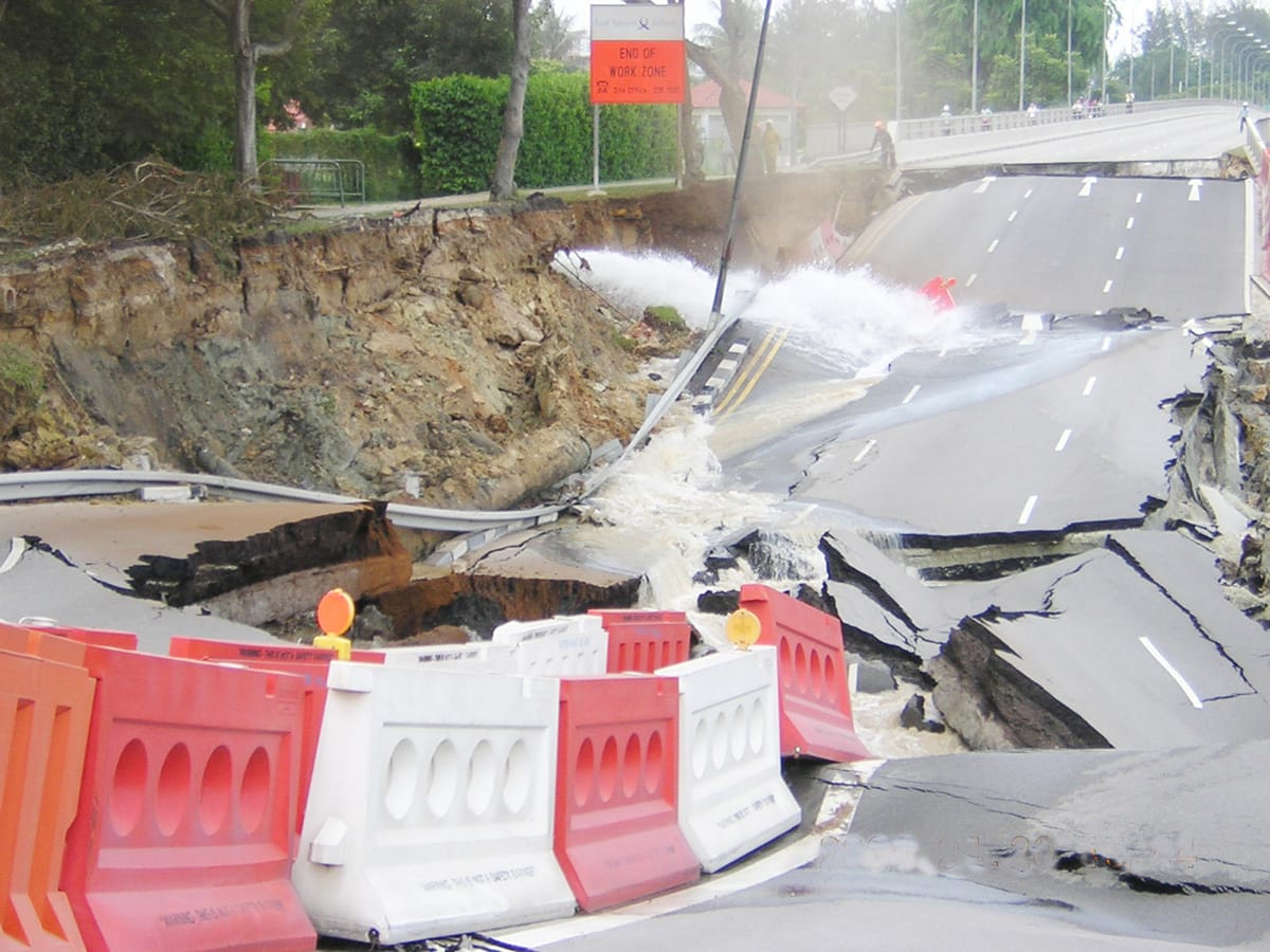 A stretch of Nicoll Highway caved in on 20 April 2004, caused by the collapse of a temporary retaining wall of a tunnel during the construction of the Mass Rapid Transit Circle Line. Collection of the National Library of Singapore.