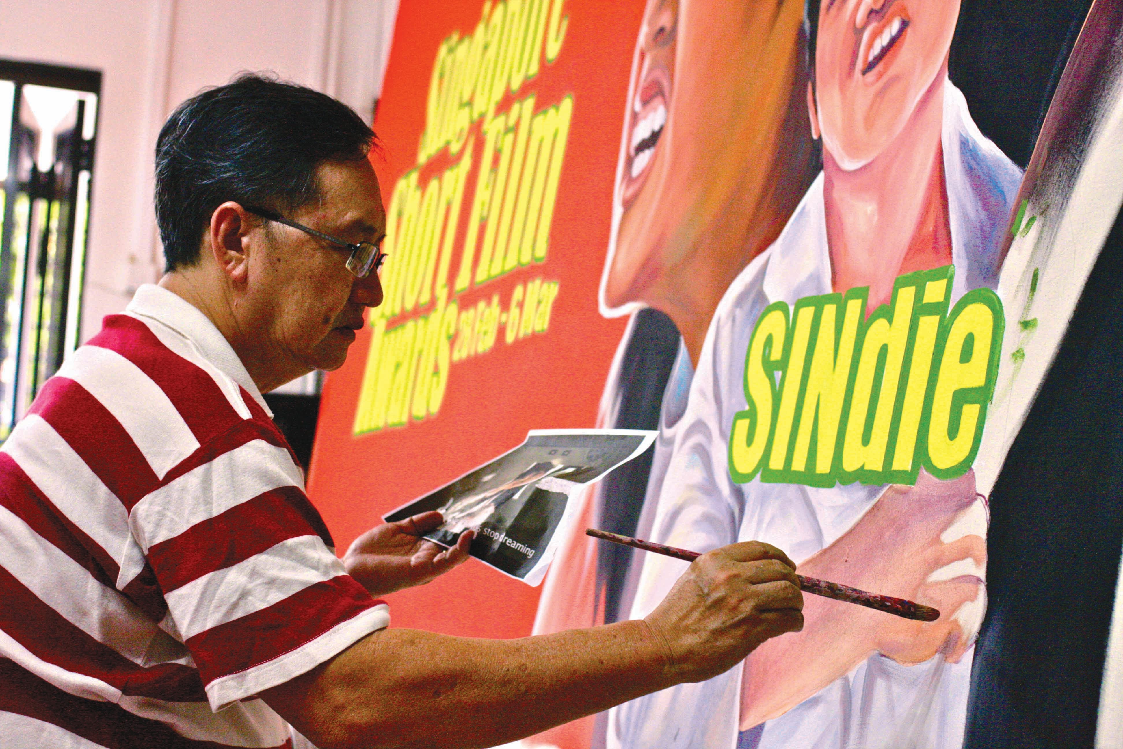 Hand-painted film posters were the rage from the 1950s to 70s but slowed down by the 80s. Here, Neo Choon Teck, one of Singapore’s last surviving billboard artists, reprises his work for the Singapore Short Film Awards in 2011. Courtesy of SINdie (www.sindie.sg). 
