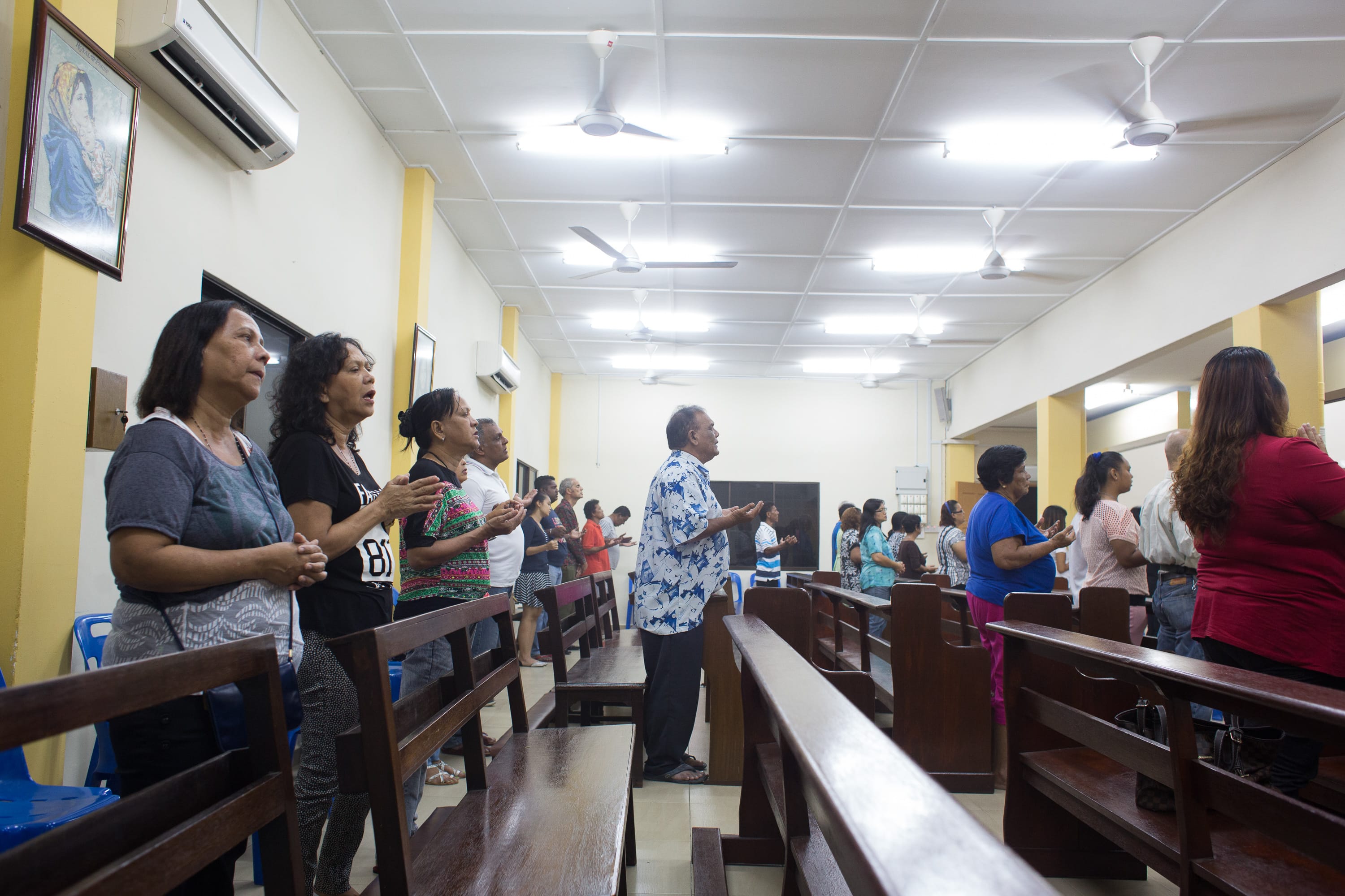 The faithful gather for Mass at the Chapel of Our Lady of the Immaculate Conception in the Portuguese Settlement. Photo by Desmond Lui. Courtesy of Melissa De Silva.