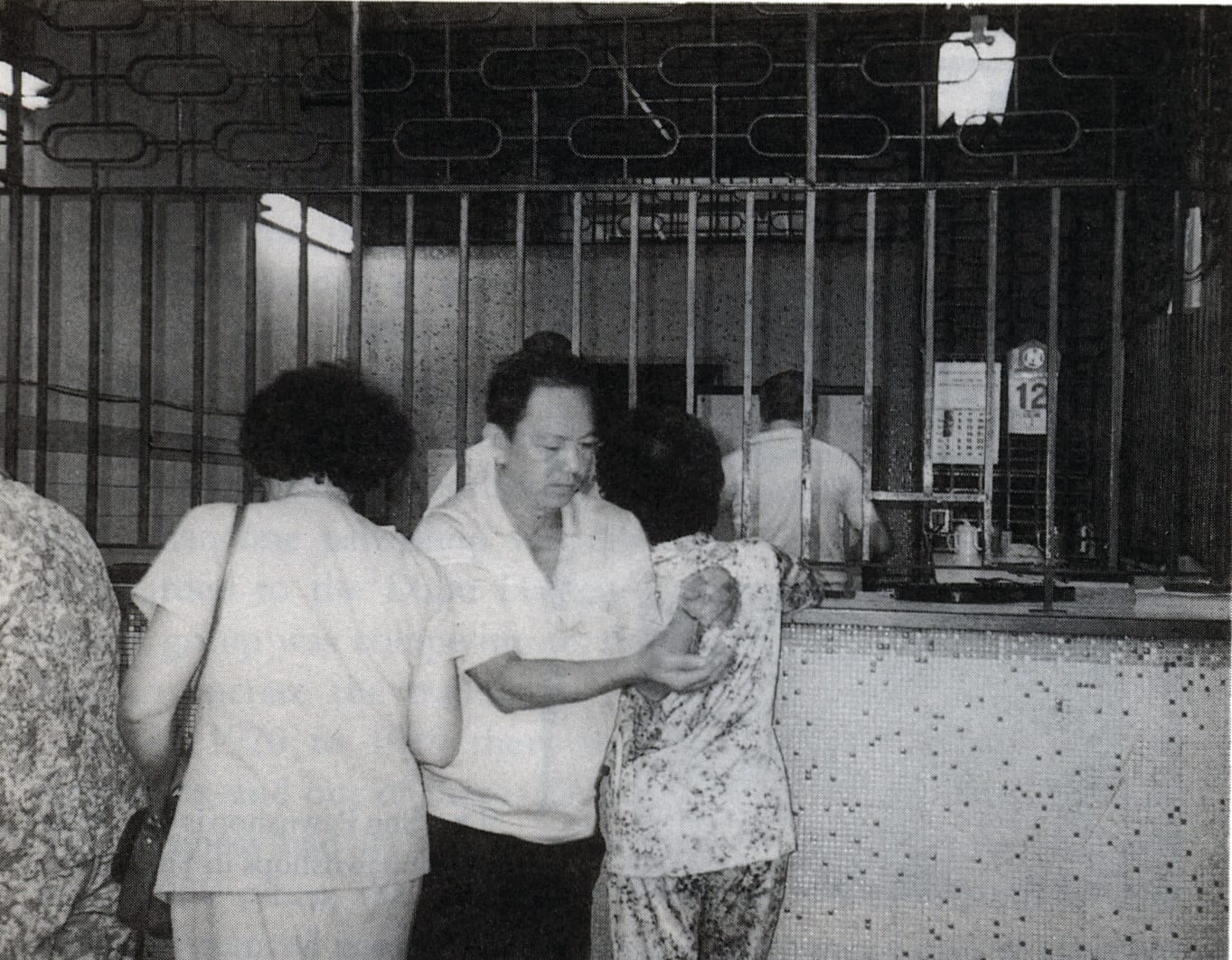 Interior of a pawnshop. Image reproduced from Tan, T. (Ed.). (1990). Chinese dialect groups: Traits and trades, p. 70. All rights reserved, Opinion Books, 1990.