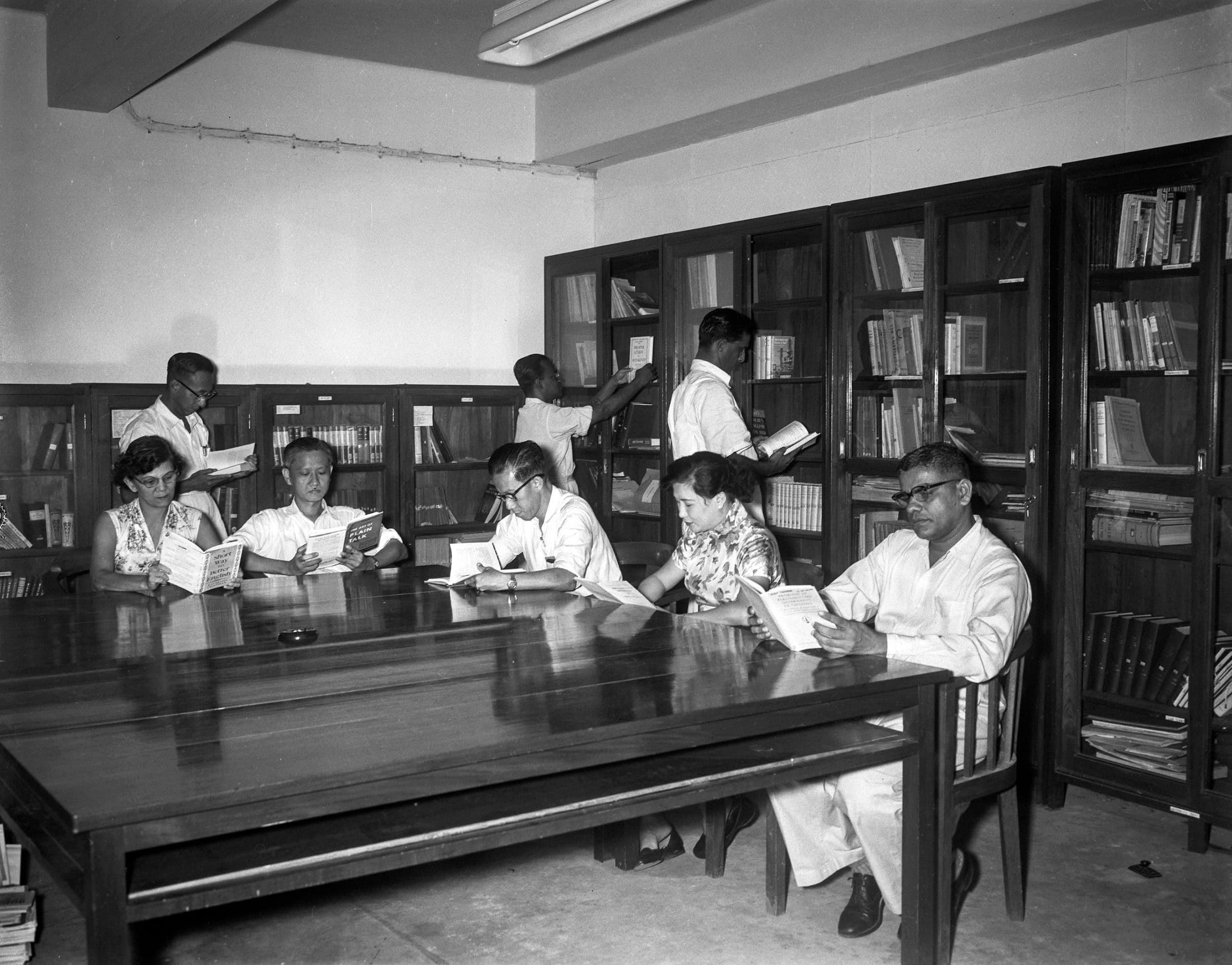 Staff of the Raffles Library photographed in 1957. Between 1954 and 1967, the archives was a department under the Raffles Library, later renamed as the National Library. Ministry of Information and the Arts Collection, courtesy of National Archives of Singapore.