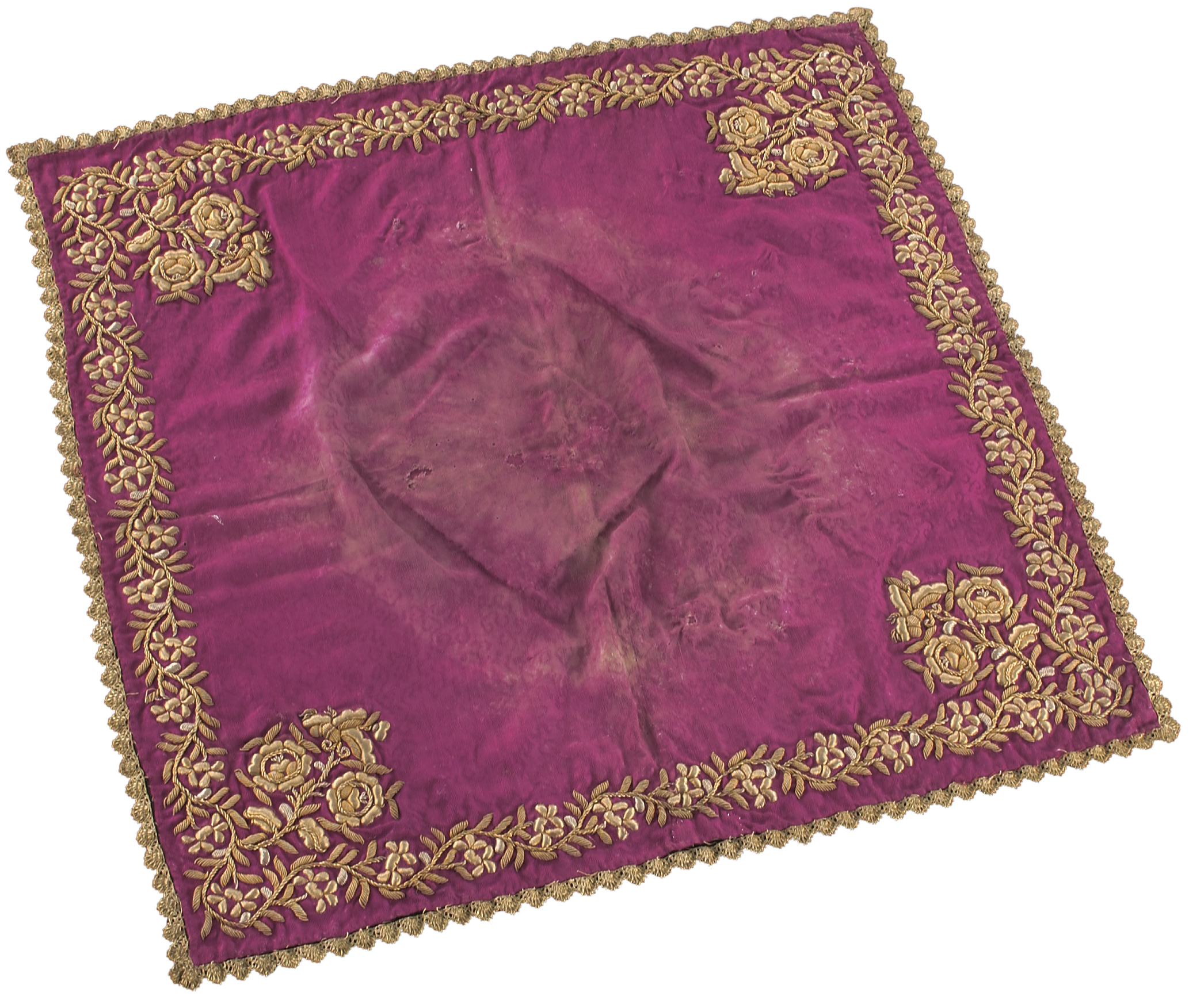 Figure 2: Tray cover or handkerchief with gold embroidery of floral stems at each corner, probably from Java, late 19th or early 20th century. Courtesy of the National Museum of Singapore, National Heritage Board.