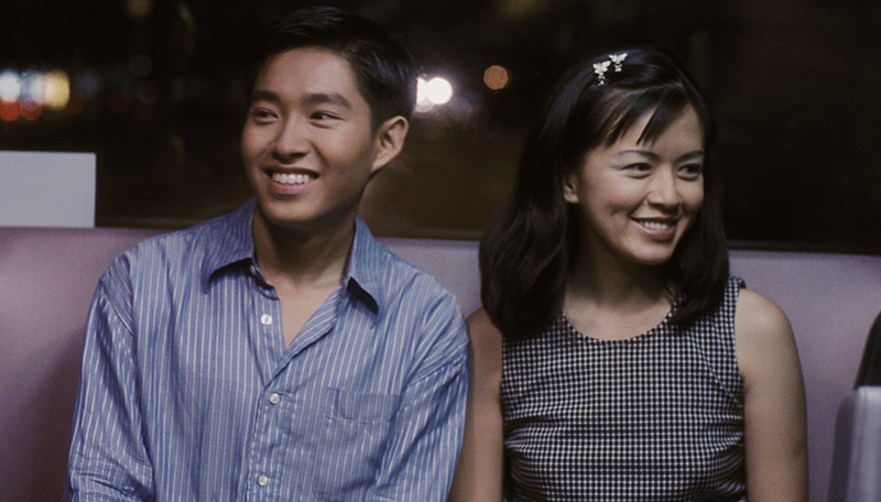 Actress and host Melody Chen (right) made her debut feature lead performance in The Teenage Textbook Movie (1998) as Mui Ee. The film also stars Caleb Goh (left), who coincidentally made his debut performance in Forever Fever in the same year. Courtesy of Vue Networks and Asian Film Archive.