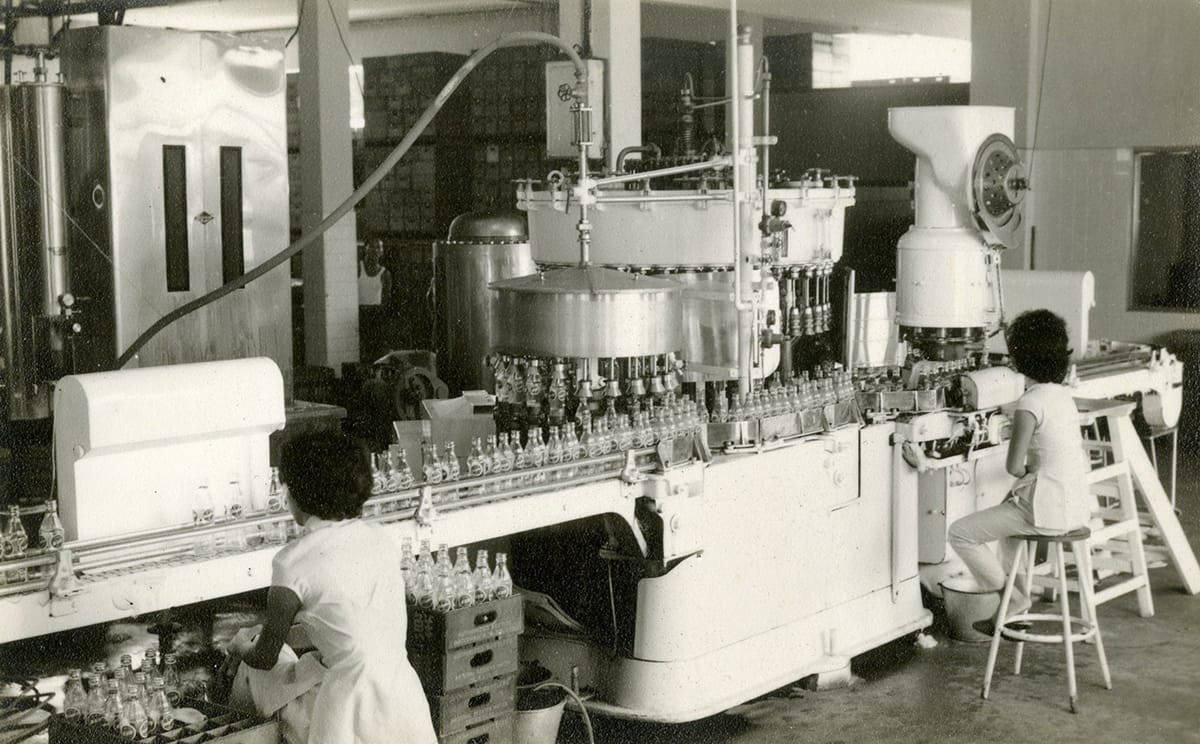 Workers bottling Sinalco at the factory of the National Aerated Water Company on Serangoon Road, c. 1950s. Courtesy of URA Collection.