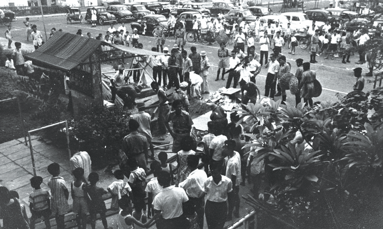 Demolition of hawker stalls at St Michael's estate in progress in 1962. Courtesy of National Archives of Singapore.
