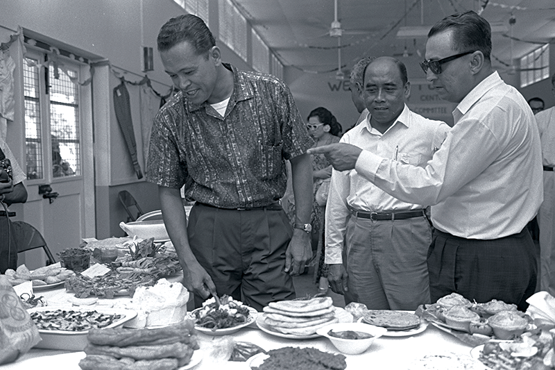 Minister for Culture and Social Affairs Othman Wok (far left) at the opening of the wheat food exhibition organised by the Siglap Women’s Association at Siglap Community Centre, 1967. Ministry of Information and the Arts Collection, courtesy of National Archives of Singapore.