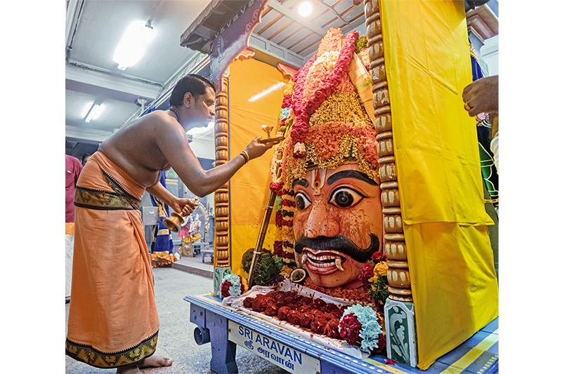 Processional icon of Aravan at the Sri Mariamman Temple, 2019. The piece of white cloth placed around the neck of Aravan has been smeared with kungumam (vermillion) representing the blood of the sacrificed Aravan. Courtesy of the Hindu Endowments Board.