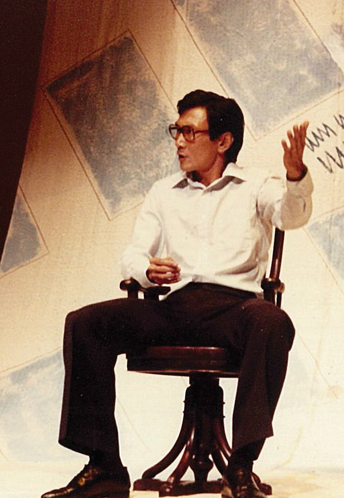 Lim Kay Tong performs in the 1985 English Production of Kuo Pao Kun’s The Coffin is Too Big for the Hole, where a frustrated, man-in the-street narrator grapples with a bizarre bureaucracy and society’s traps of conformity at his grandfather’s funeral. Courtesy of The Theatre Practice Ltd.