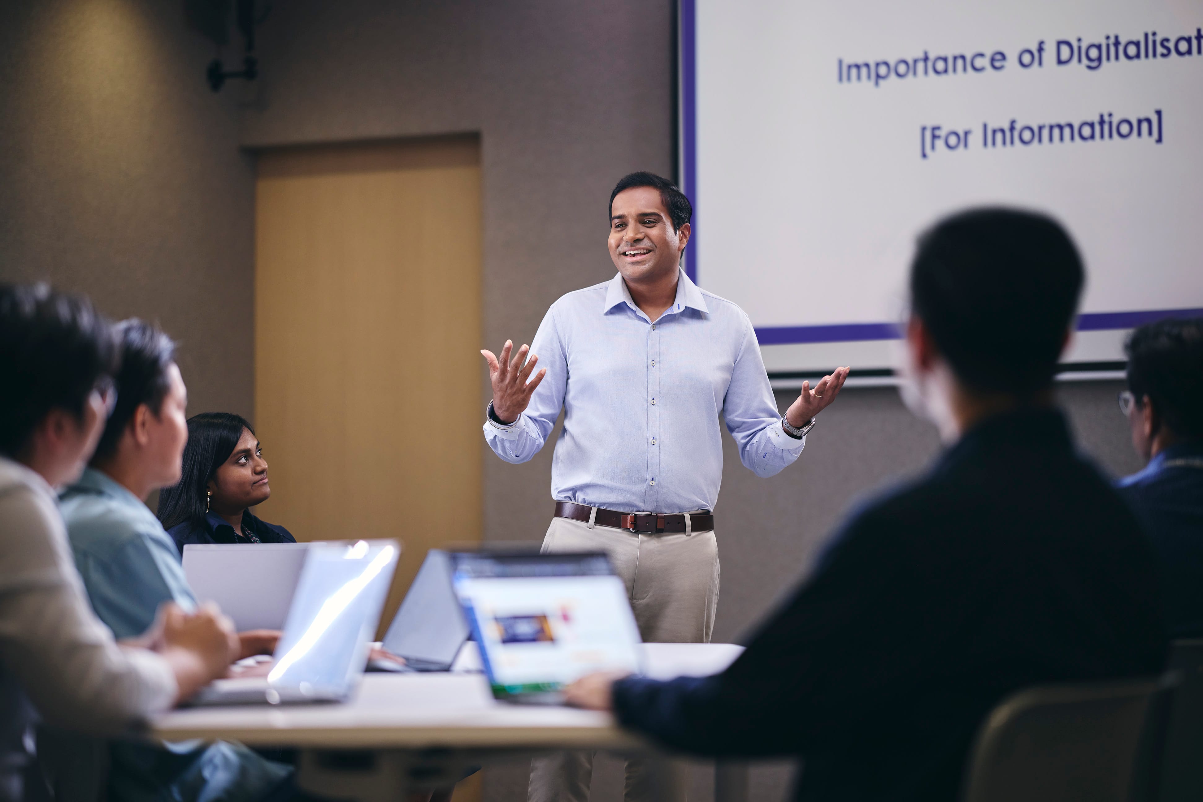 A Civilian officer giving a presentation in the office