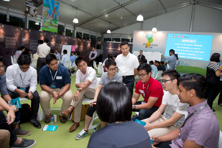 Group of people sitting in a circle, with 'the future of us' branding in the background.