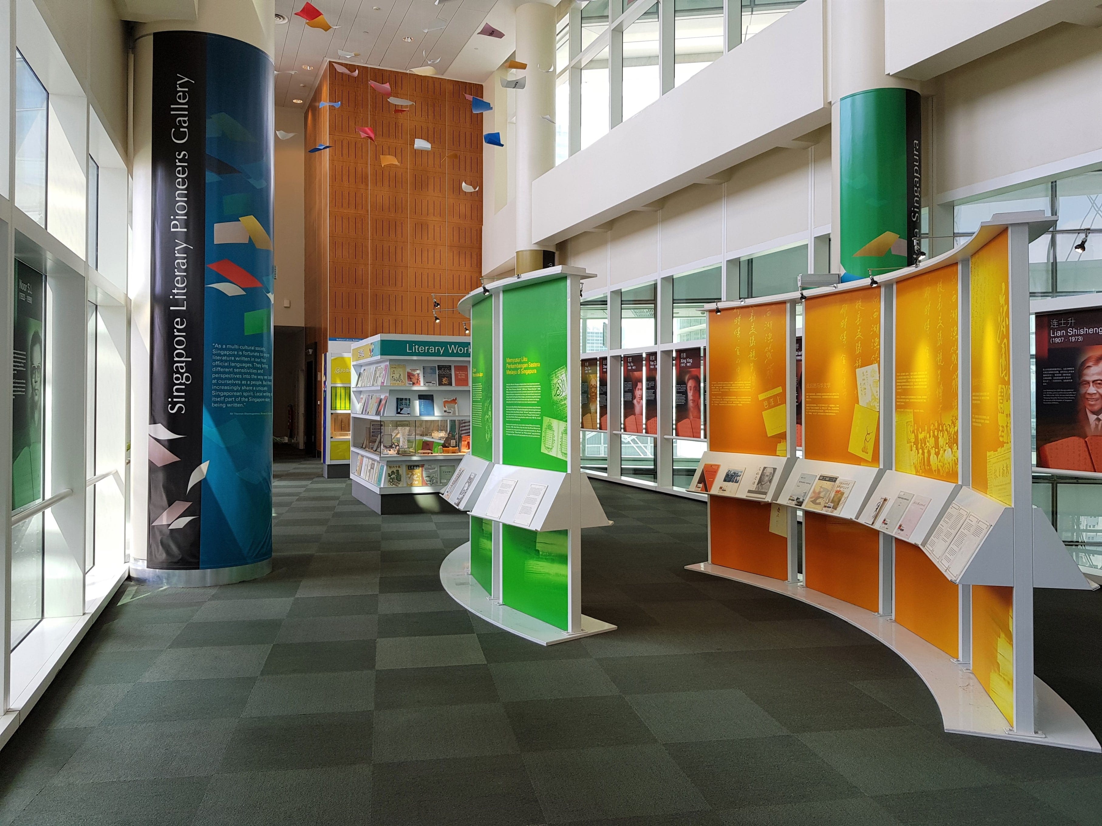 A colorful library exhibit with informational panels and display cases, labeled "Singapore Gallery".