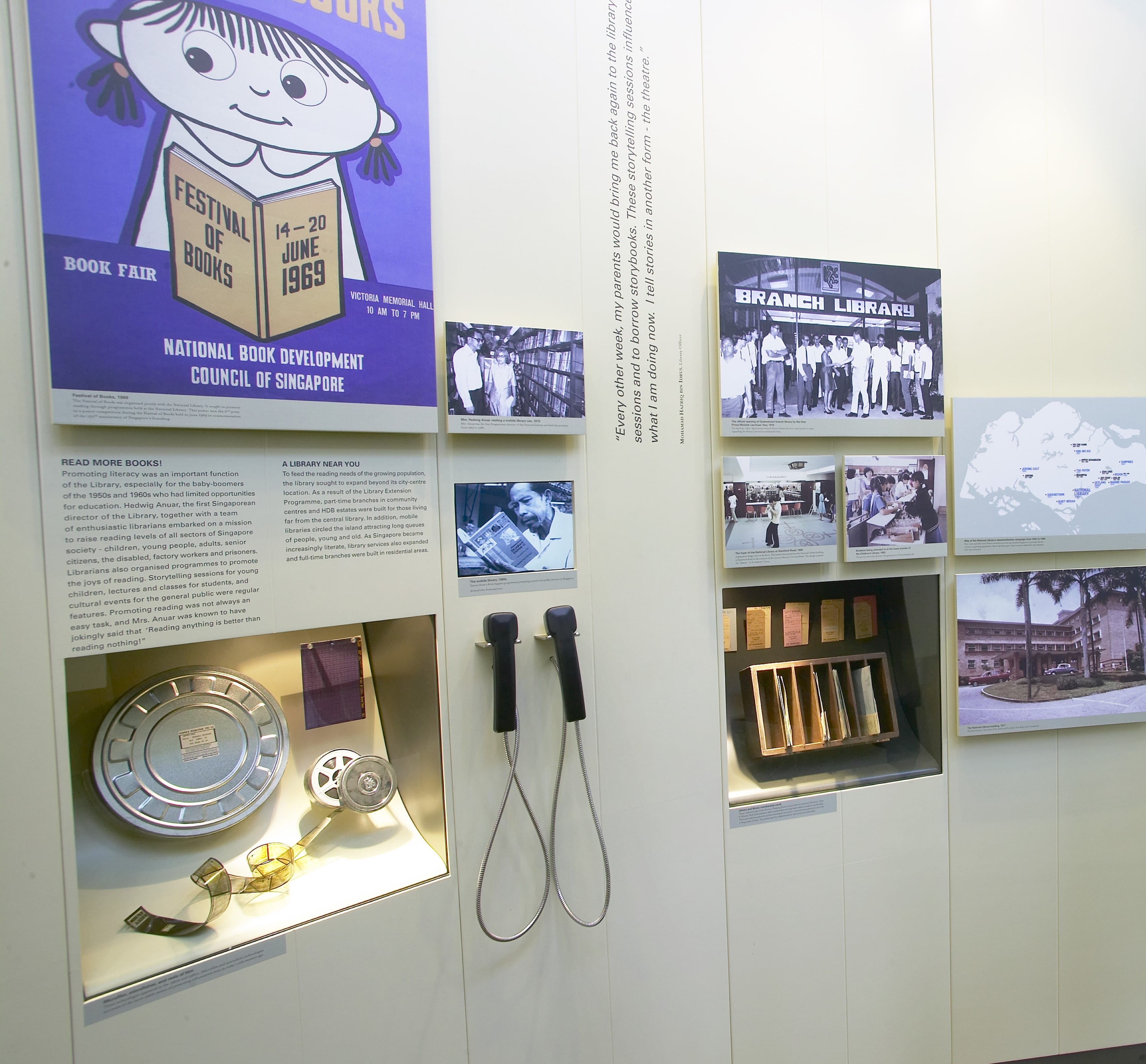 Display features historical items, photos, and text related to libraries, book fairs, and media development in Singapore.