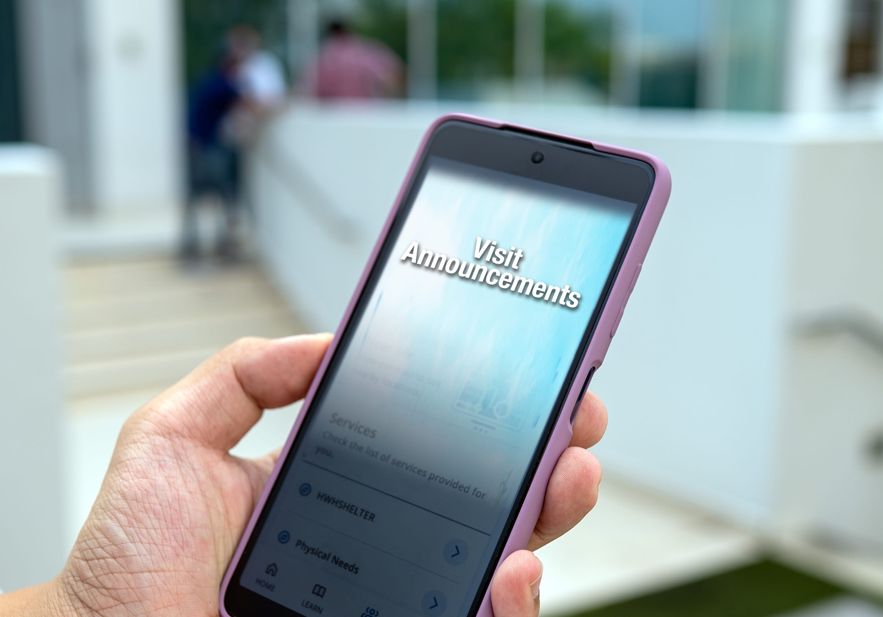Handphone with Visit Announcement on screen