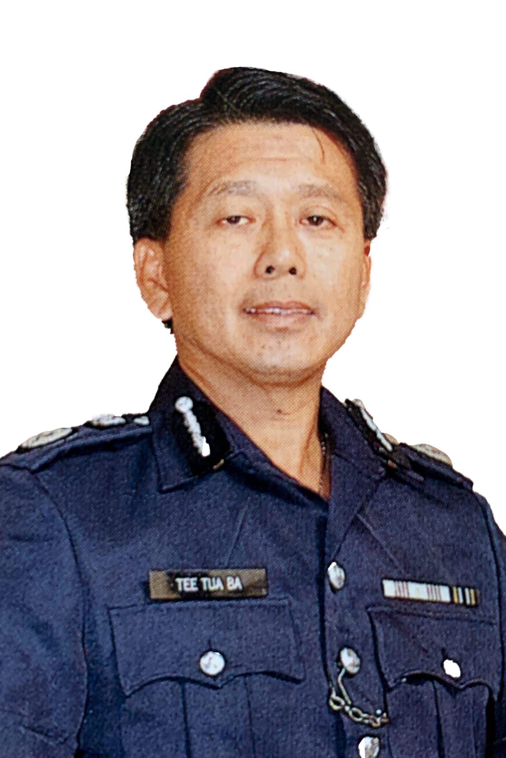 A person in a dark police uniform with visible insignia and a name badge reading "Tee Tua Ba".