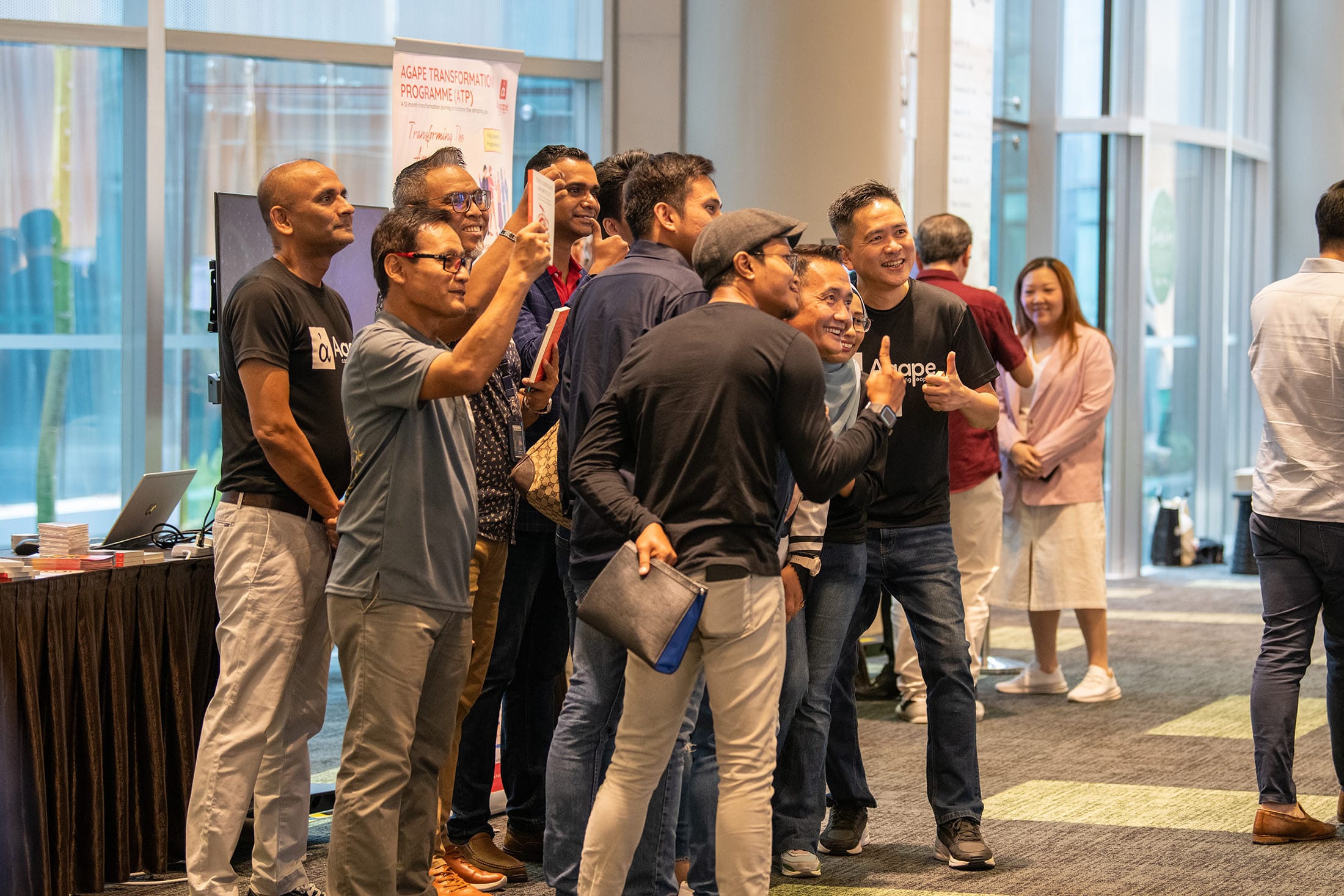 Man speaks at a Singapore EXPO podium before a screen reading Singapore Prison Service Desistor Network launch.