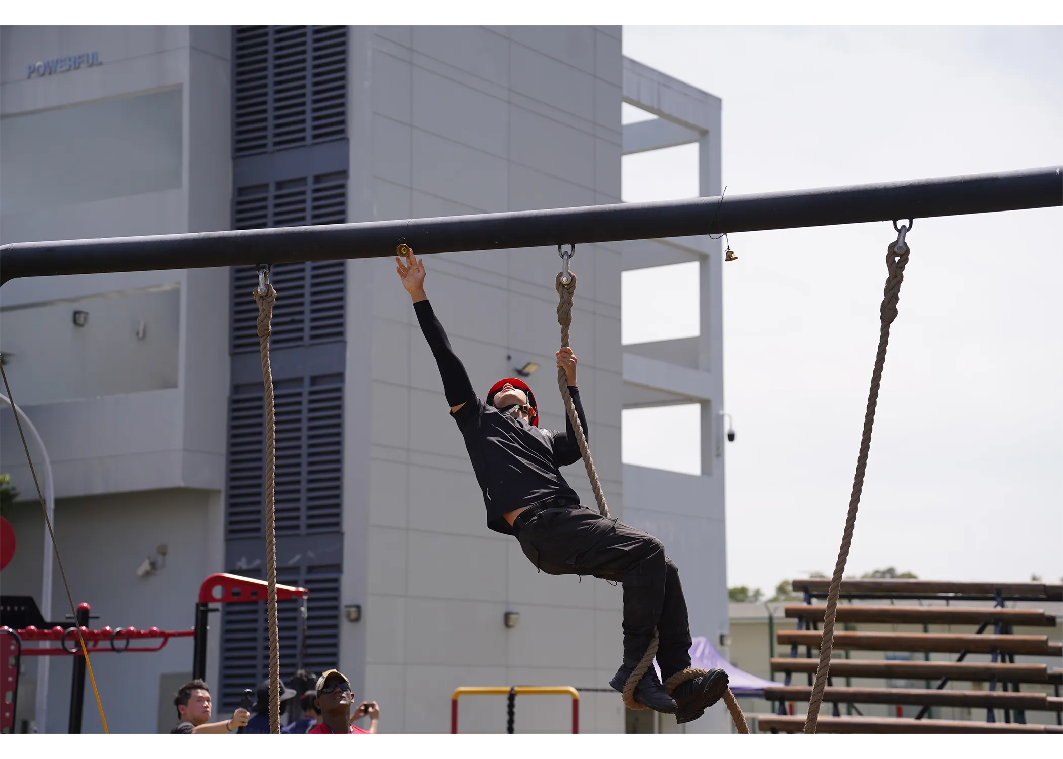 An officer that successfully touched the bell at the top of the low rope obstacle course.