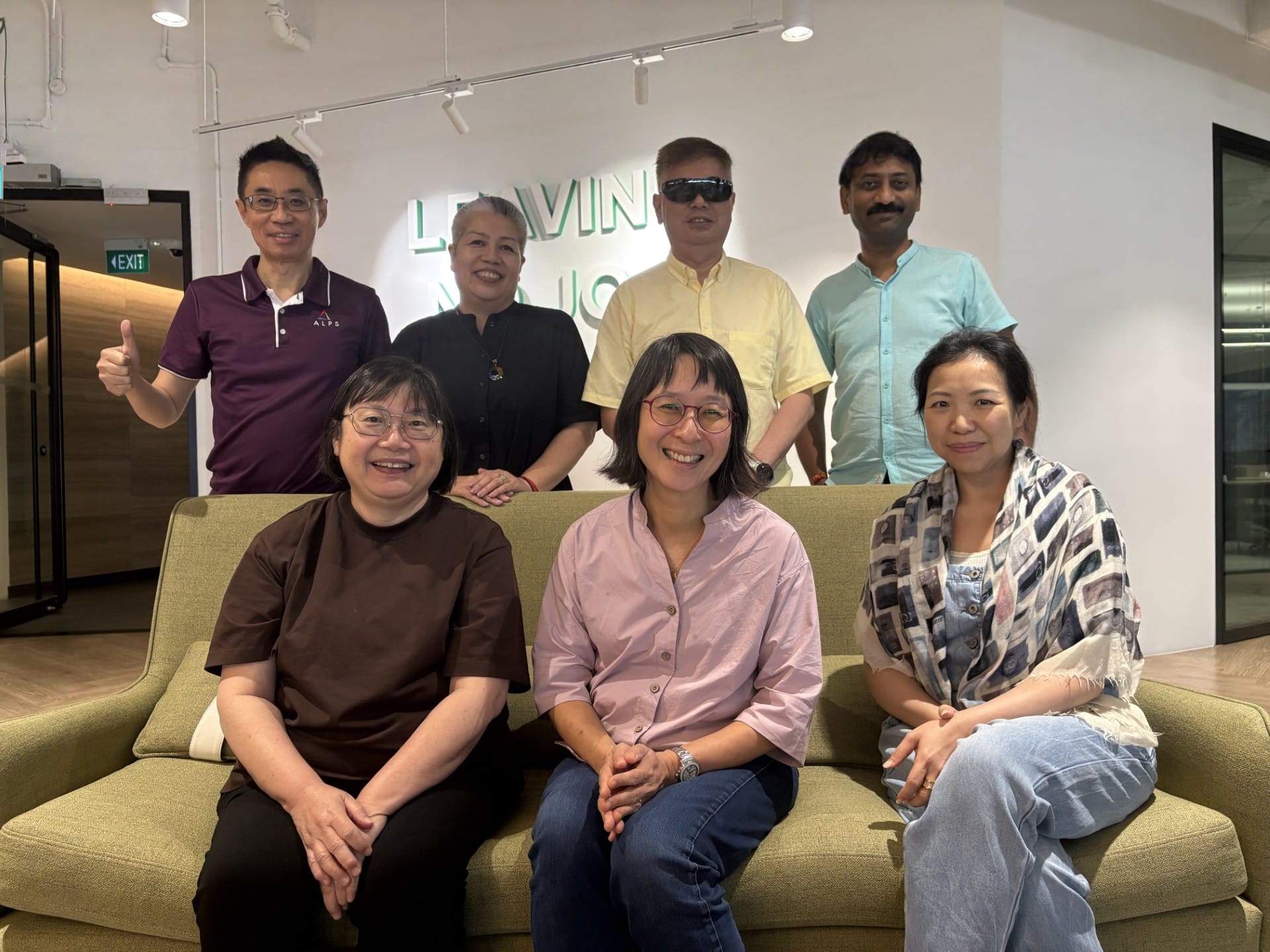 Image of ALPS C-suite - CEO, COO, CFO, CHRO, COO, and CISO - engaged in team-building activities, alongside the facilitator.
