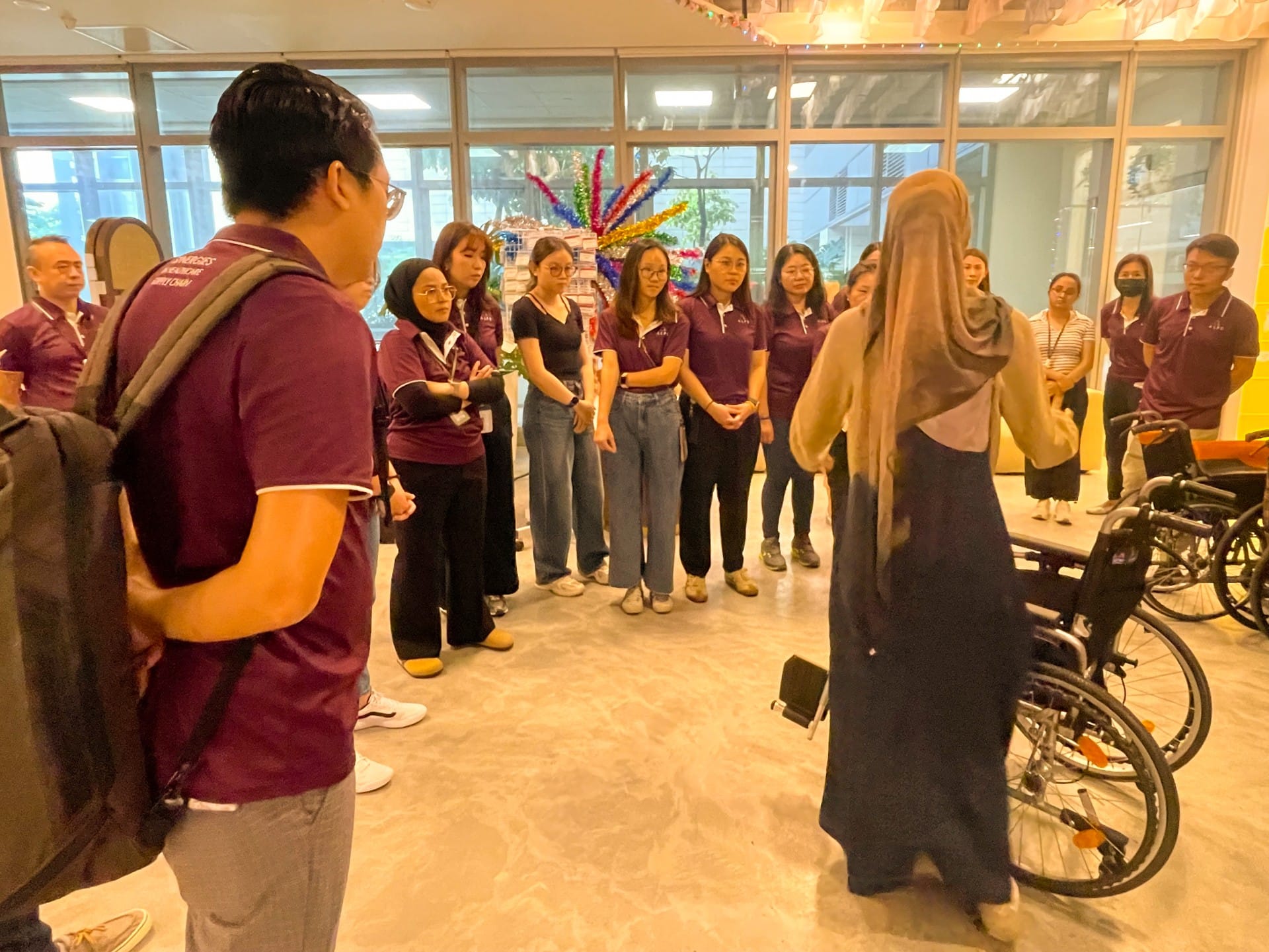 Image of ALPS Staff interacting with the patients at HCA Hospice Oasis@Outram